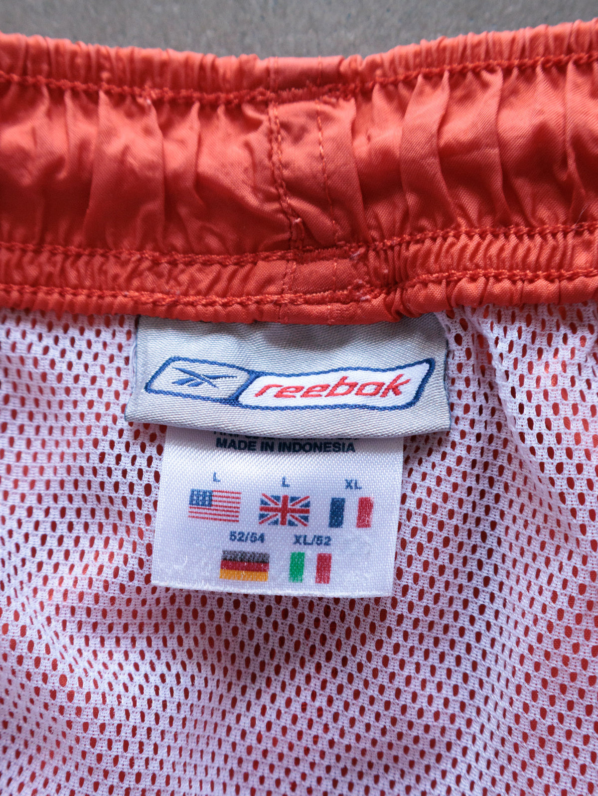 Vintage 00s Orange Reebok Swim Shorts (L)
