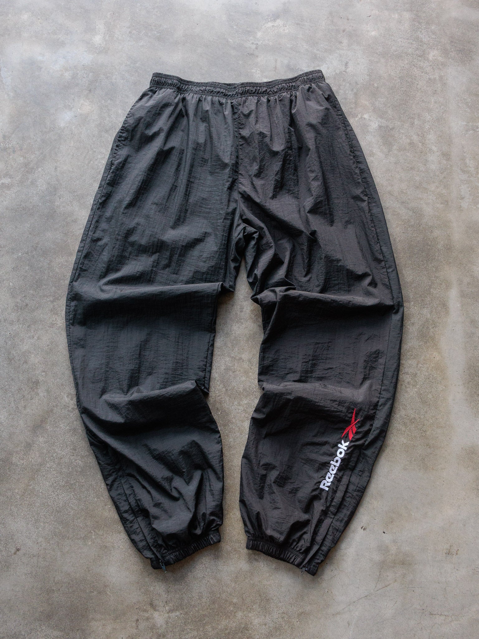 Vintage 90s Black Reebok Spell Out Track Pants (XL)