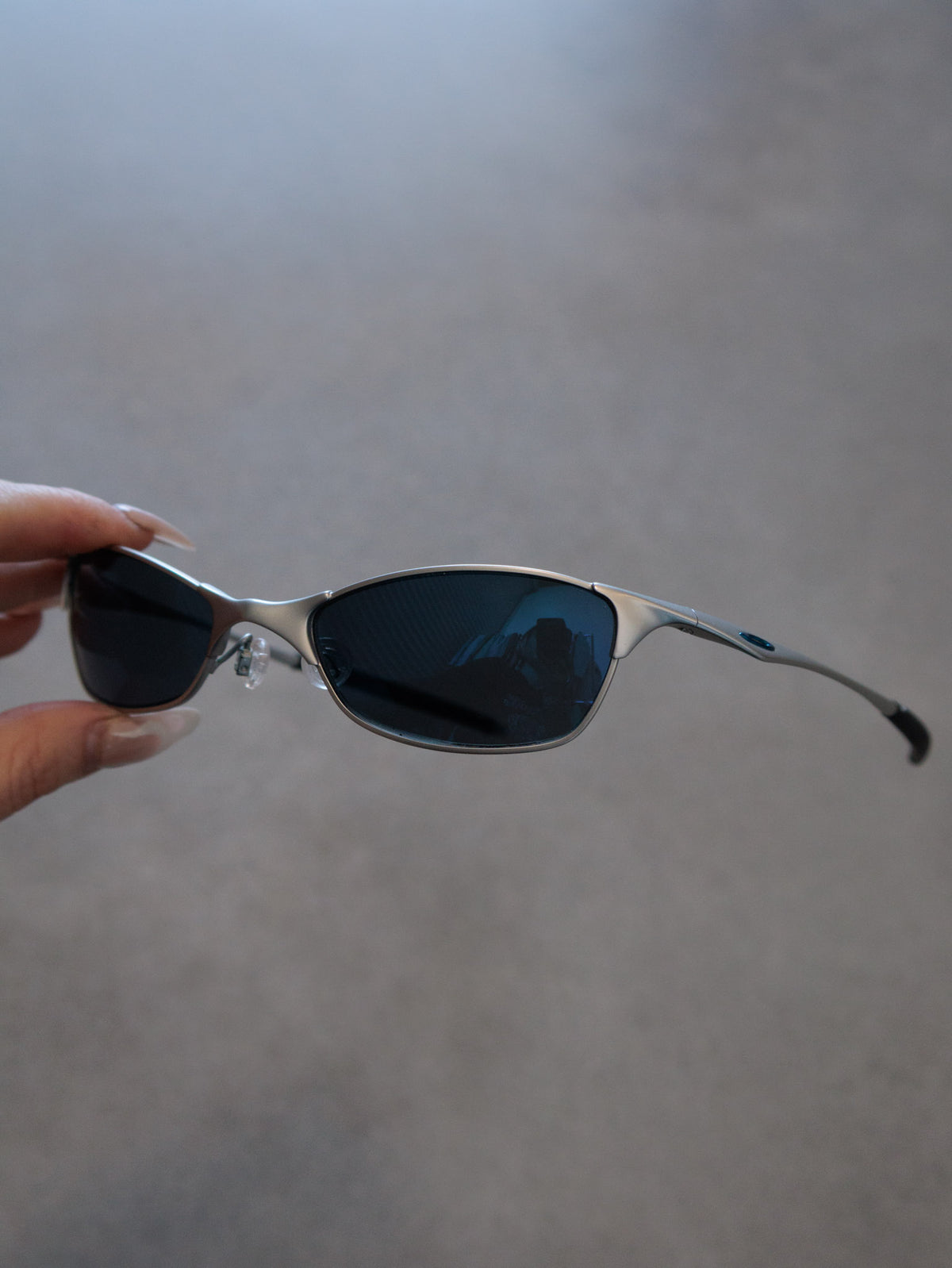 Vintage 00s silver Oakley Wiretap 1.0 sunglasses with blue mirror lenses